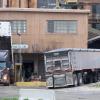trucks unloading at Venture Milling  site