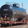 a tank car on a flat bed in the yard